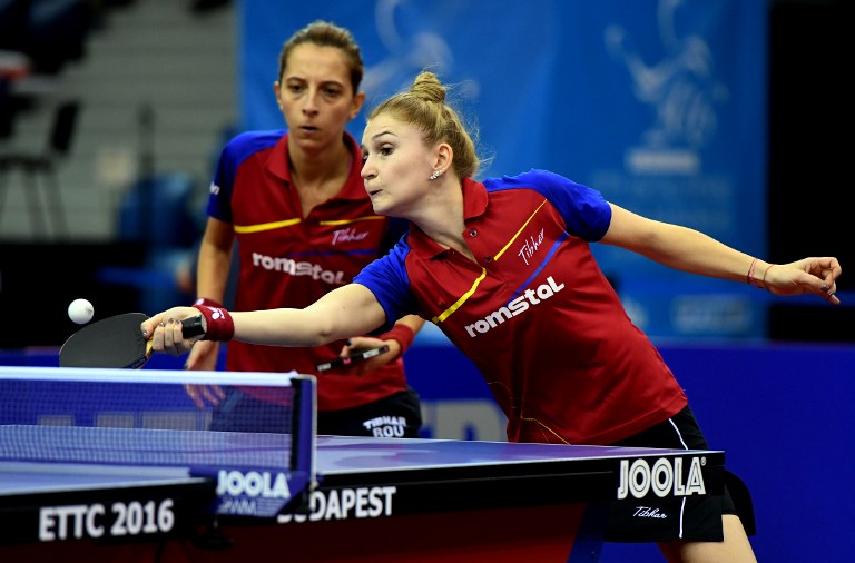 Romanian Daniela Monteiro Dodean (R) and Elizabeta Samar (L) vie against German Xiaona Shan and Petrissa Solja in Budapest on October 22, 2016 during the women double semi-final of the 2016 ITTF European Table Tennis Championships. / AFP PHOTO / ATTILA KISBENEDEK