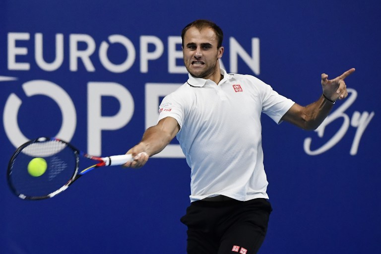 Romania's Marius Copil returns the ball to Belgian's David Goffin during the quarter final match of the first edition of the European Open tennis tournament on October 21, 2016 in Antwerp. / AFP PHOTO / BELGA / DIRK WAEM / Belgium OUT