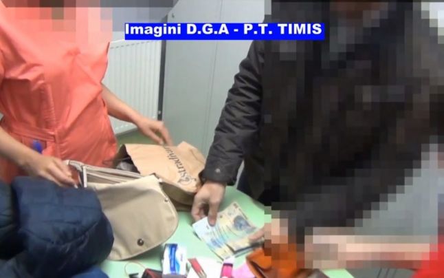 Medic ginecolog din Timişoara, prins în timp ce lua de mită